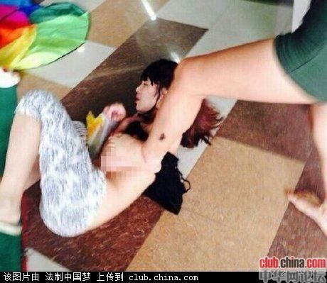 Mistress beat and stripped in public by husband's wife.