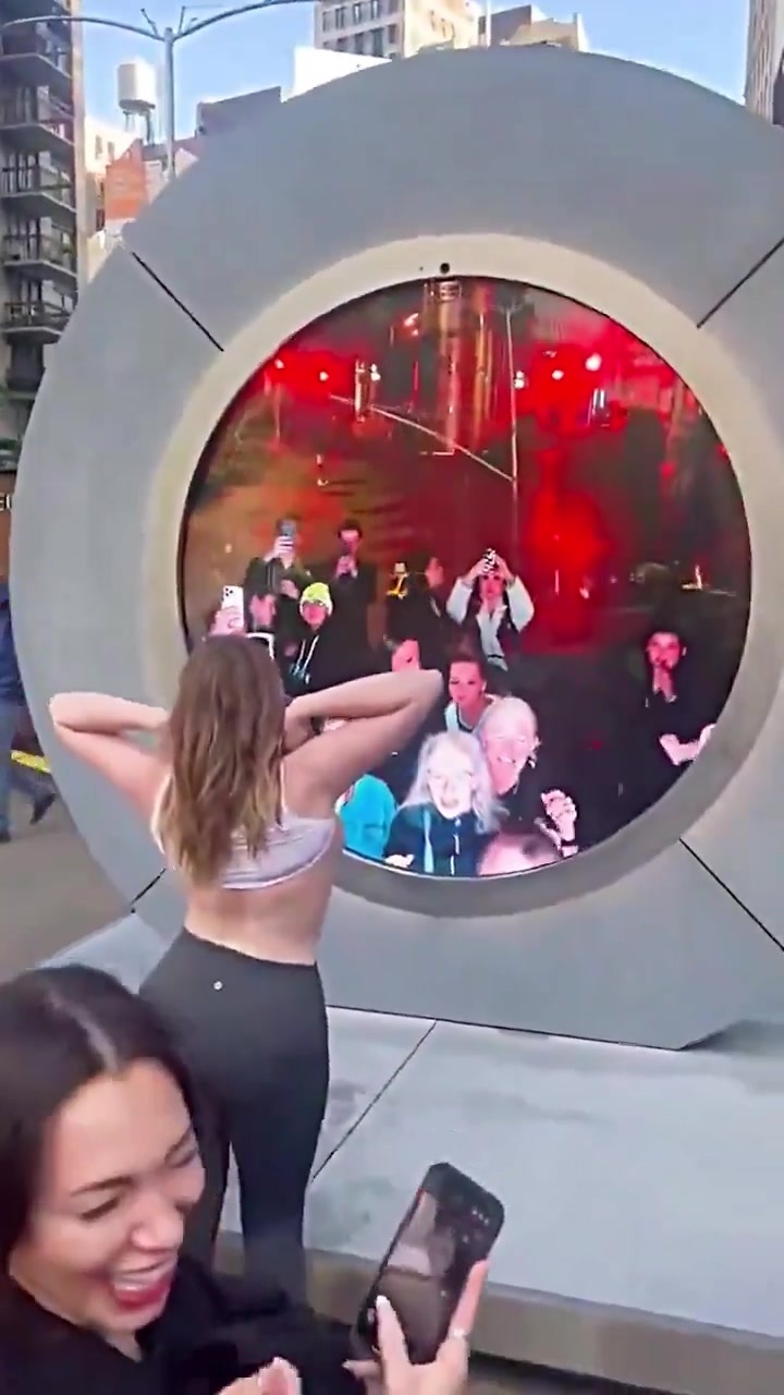 Woman Flashes Her Boobs at the NY to Dublin portal