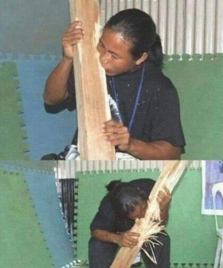 woman eating piece of wood