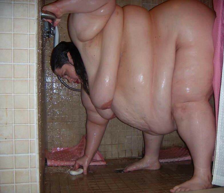 obese woman taking a bath