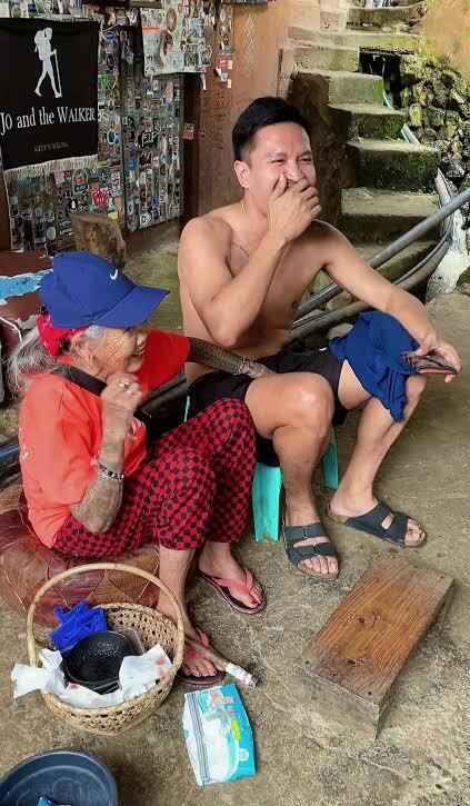 old woman touches men's penises