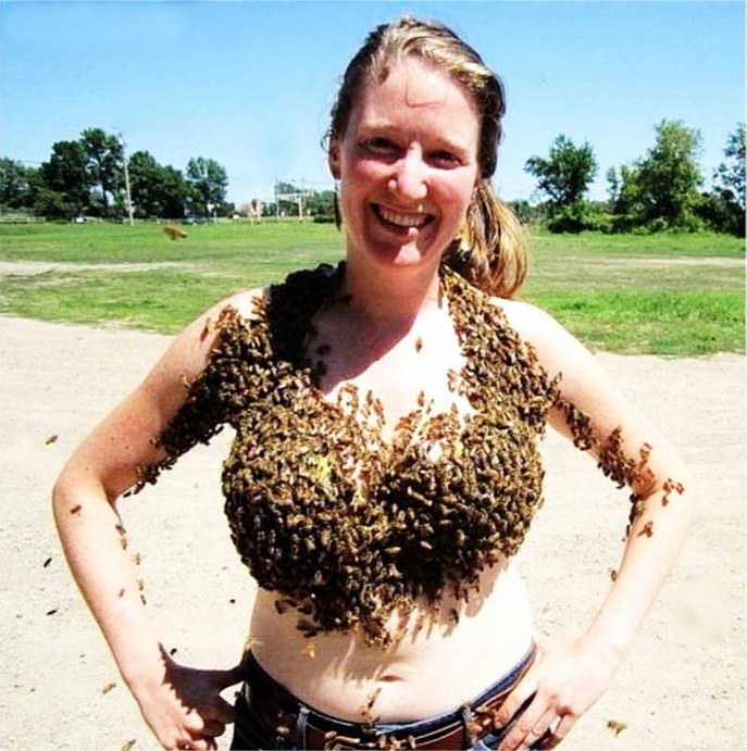 woman covered in bees