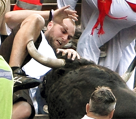 The bull gored his leg.