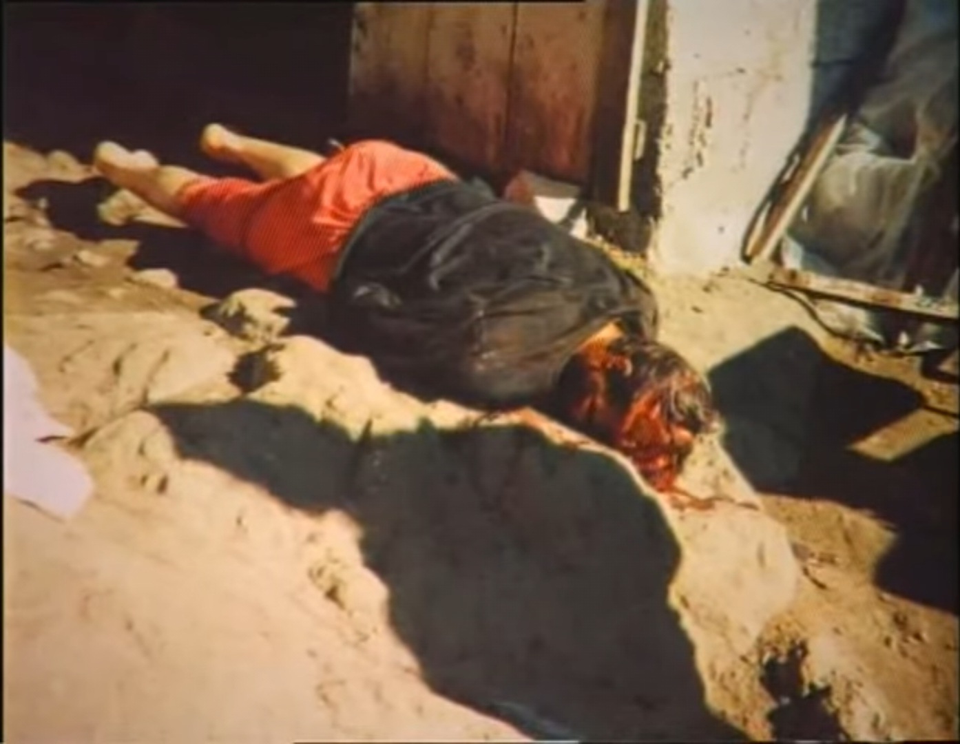His wife struck him on the head with an axe.