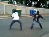 Two Men Fight With Machetes