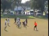 referee gets attacked by a whole team