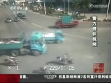 Chinese woman somersaults herself to safety after truck hits bike