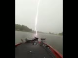 Lightning almost strikes a fishing boat.