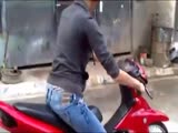 This chick isn't the most graceful on a scooter.