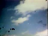 WWII Anti-Aircraft guns shooting a plane down.