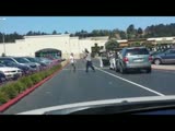 Two guys slug it out during a traffic altercation