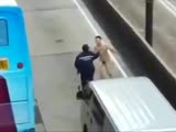 Female officer is taking down a naked nutcase.