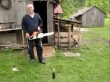 Old man open botlle of beer with chainsaw