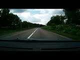 Car trys to overtake tractor but ends up rolling