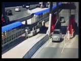 Woman smashes into toll bridge