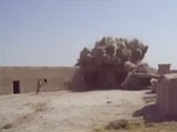 Close call for two soldiers in Afghanistan blowing up a house.