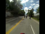 Biker wheelies into cop.