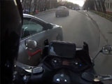 Car Driver Almost Kills Biker By Nudging Him Into Street Pole