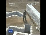Clumsy new recruit throws a grenade and almost kills himself and his instructor.