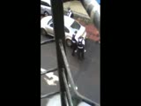 Two police officers drop a drunk girl in the bus line and just drive off.