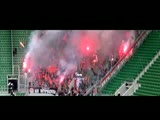 Soccer fan is set on fire by a security guard spraying gas towards him.