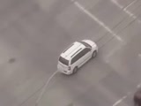 Woman Climbs Into a Bank Robber's Van During High Speed Chase