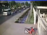 Scooter driver is carelessly hit from behind and run over by a pick-up truck.