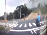 Most unlucky scooter rider slides ove the road and ends up in a manhole.