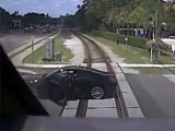 Woman Narrowly Escapes SunRail Train Plowing Into Her Car