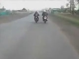 Biker Accidently Nudges His Mate Into An Oncoming Car