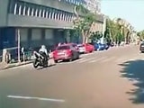 Slow Moving Car Sends A Speeding Biker Flying Over It