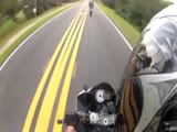 Biker holds on his sparking motorcle sliding over the road.