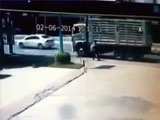 A Man Lays Down His Bags And Lies Under A Truck