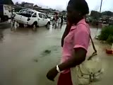 Oblivious woman falls into deep pothole