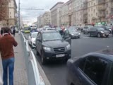 Guy Securing His Car To Fence With Chainlock