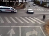 Ambulance Causes Car To Wipe Out Two Pedestrians