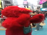 Guy Dressed Up As Elmo Screams out,