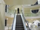 Girl Pisses On An Escalator!