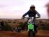 Spectator Filming A Motocross Race Gets A Bike To The Face