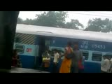 Indian woman beating guy at the railway station