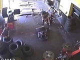 Tire Explodes In Mechanics Face During Fitting