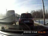 Truck hits the car and rolls over