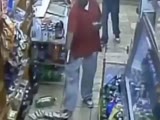 Group of guys casually walk past a man who was just gunned down in a store