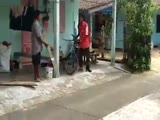 Man Is Knocked Out Of His Flip Flops When He's Hit In The Head With A Plank