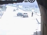 Traffic Officer Standing In The Road Somersaulted By A Car