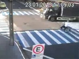 Biker Slides Head First Under The Wheels Of A Truck At An Intersection