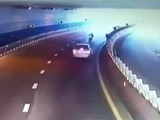 Driver And Biker Meet Each Other Head On In A Tunnel