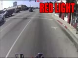 Biker confronts red light runner and scares the shit out of him