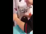 Disgusting barber spits on customers hair while washing it