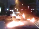 Biker Flies Over A Car On Fire After Head On Collision